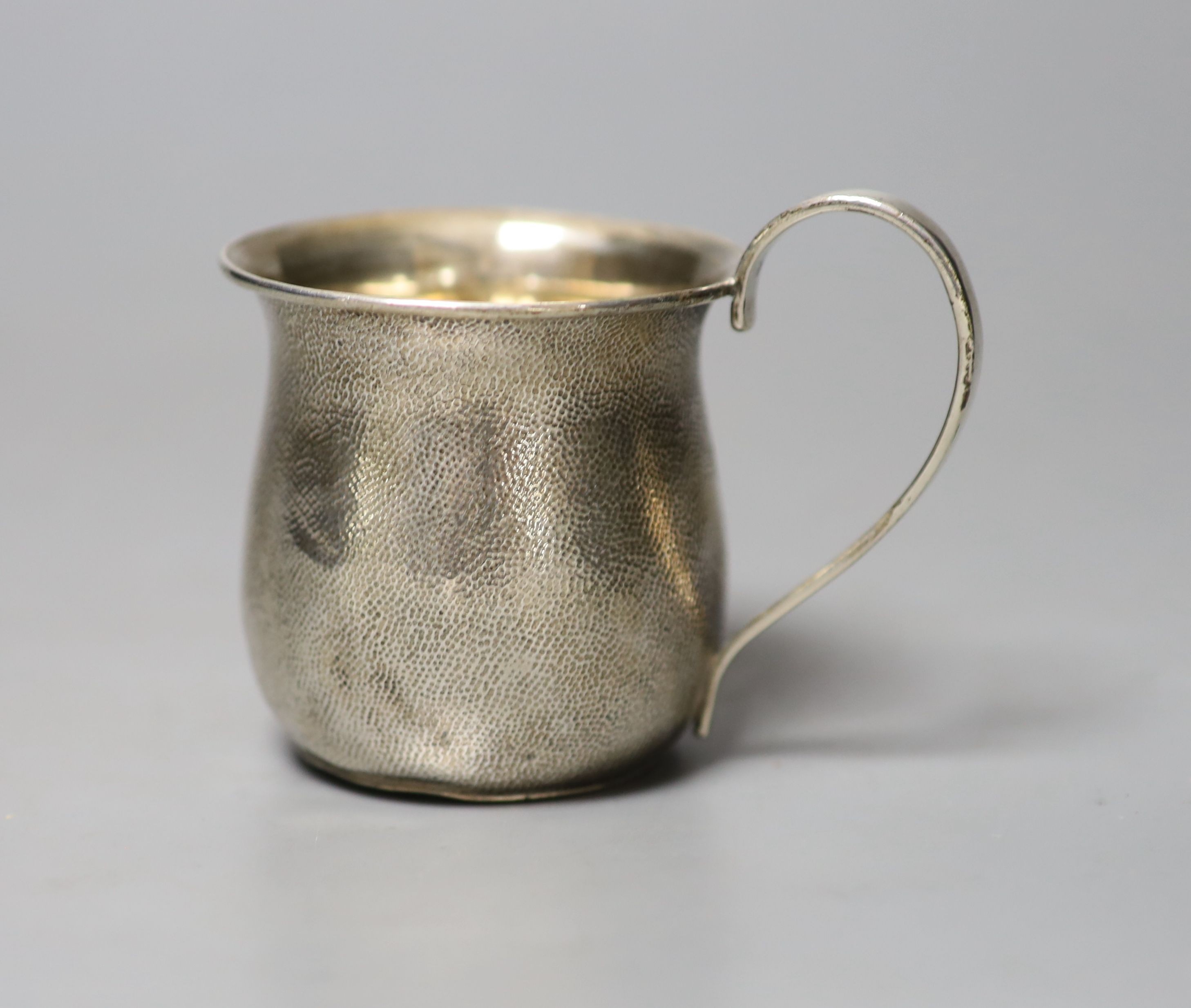 A Chinese planished white metal small mug, stamped 'WK90', 7cm, 80 grams.